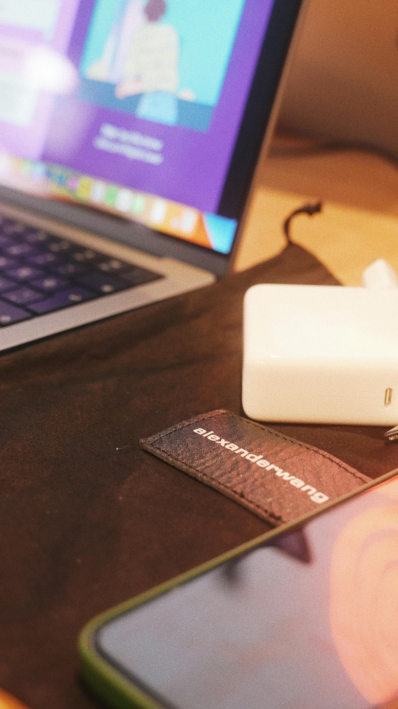 Smartphone and laptop on a desk used as article artwork.